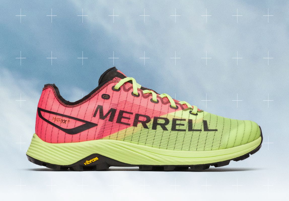 Person wearing white MTL Long Sky 2 Matryx shoes on rocks.